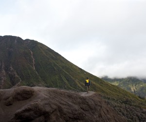 Man climbing a volcano in Bromo-Tengger-Semeru National Park