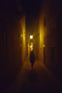 Walking in a dark alley of the Silent City Mdina