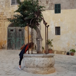 Looking into an old well in Mdina Malta