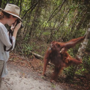 Girl photographing orang utans in Tanjung Puting Kalimantan