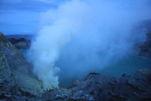 Sulphur fumes over Kawah Ijen crater lake at daybreak