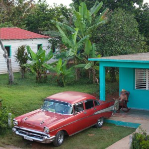 Cuban man and his classic car in Vinales