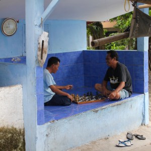 Men playing chess on the street in Yogyakarta
