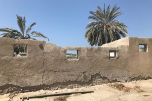 Crumbling wall in Jazirat Al Hamra ghost village