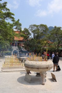 Offering incense in front of Po Lin Monastery, Lantau Island