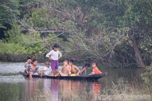 Children playing on a canoe near Kwatamang Landing Guyana