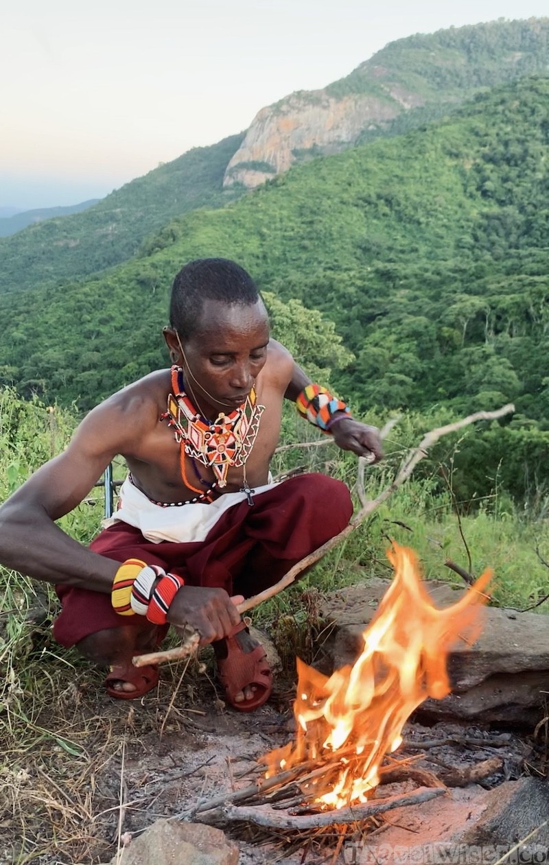 Samburu askari making a campfire near Kitich, Mathews Mountain Range Kenya