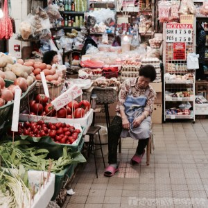 Saleswoman napping at Causeway Bay Market Hong Kong