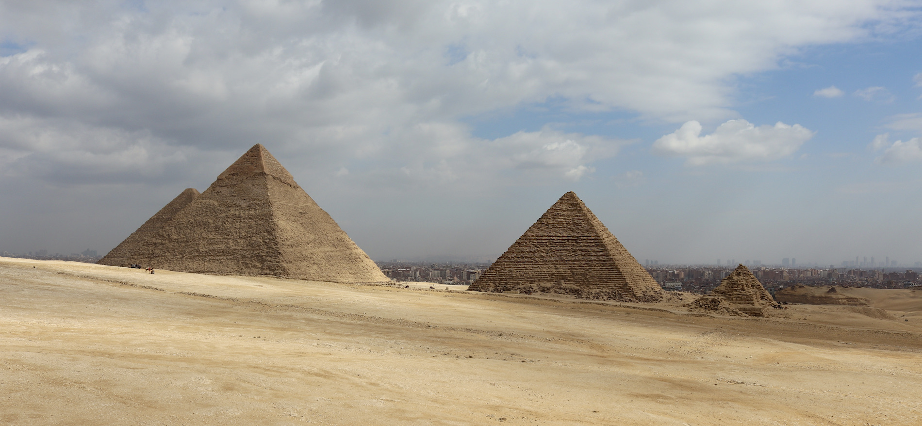 Giza pyramids against Cairo city backdrop