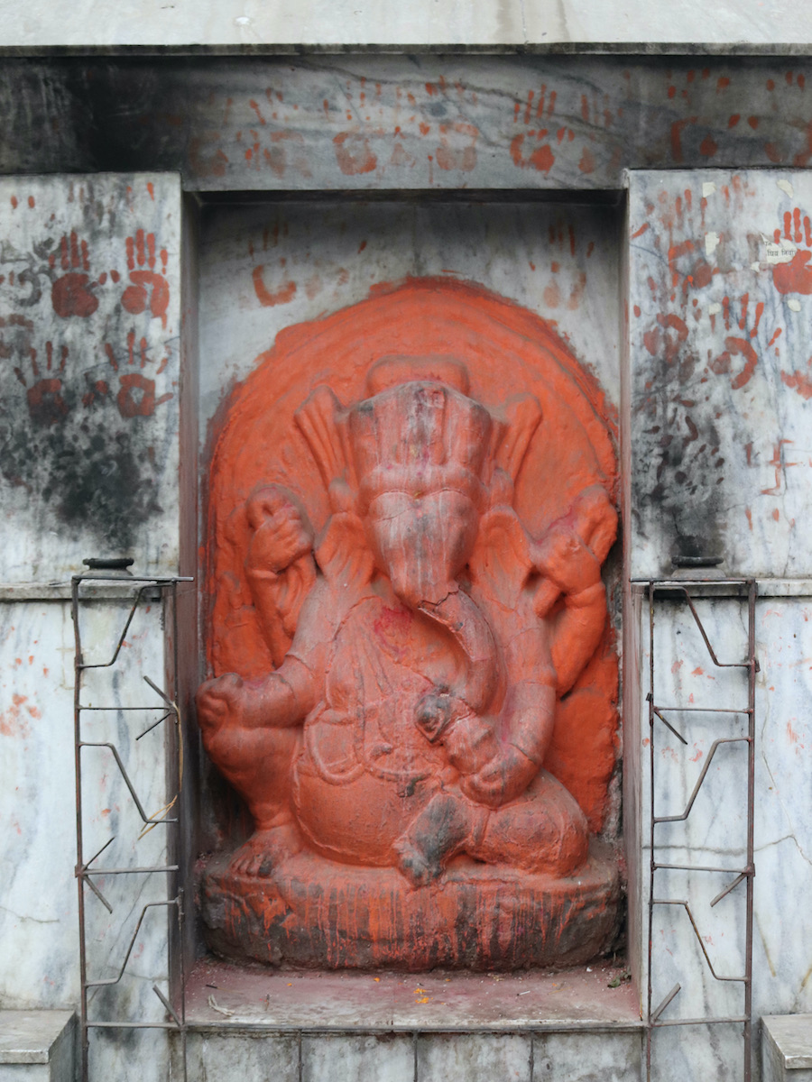 Red Ganesh statue with hand prints Kathmandu